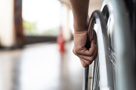 person in wheelchair, paralysis injury lawsuit