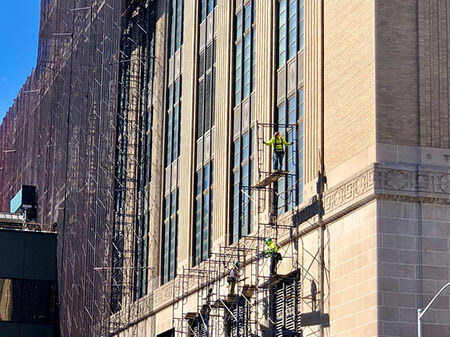NYC workers on scaffolding