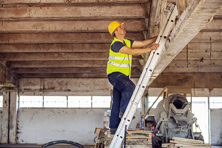Construction Worker Using a Ladder