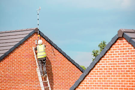 construction worker on ladder