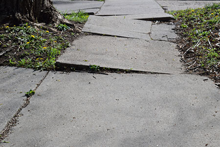 Cracked sidewalk, NYC Sidewalk accident lawyers